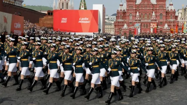 Russian service members march during a rehearsal for a military parade marking the anniversary of the victory over Nazi Germany in World War Two in Red Square in central Moscow, Russia