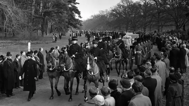 A gun carriage bearing the coffin of King George VI, making its way from Sandringham to Wolferton station on 11 February 1952