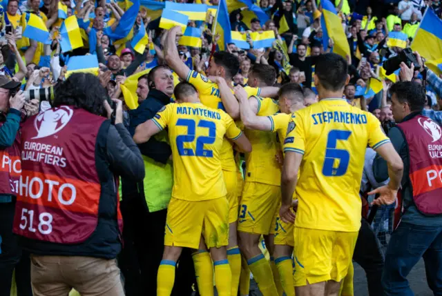 Ukraine players celebrate their second goal early in the second half