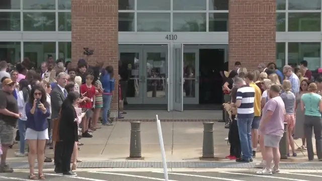 People gather outside courtroom