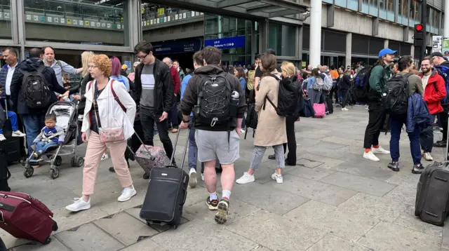 People queueing outside St Pancras in central London