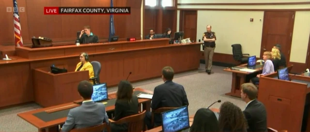 The jury, who are not on camera, receive instructions from the judge