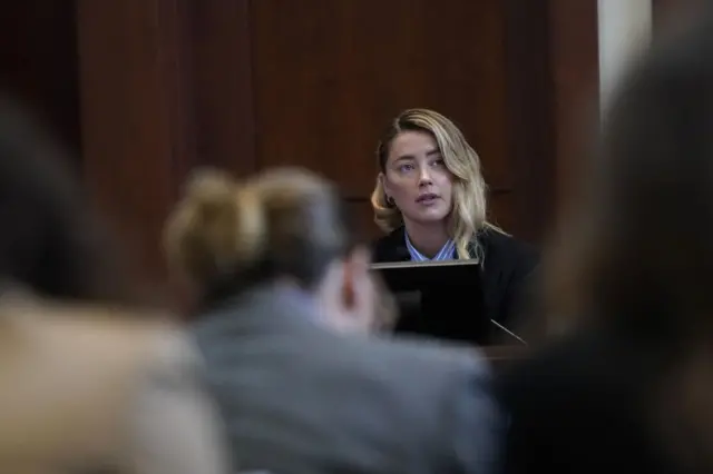 Actor Amber Heard testifies at Fairfax County Circuit Court during a defamation case against her by ex-husband, actor Johnny Depp in Fairfax, Virginia, on May 4, 2022