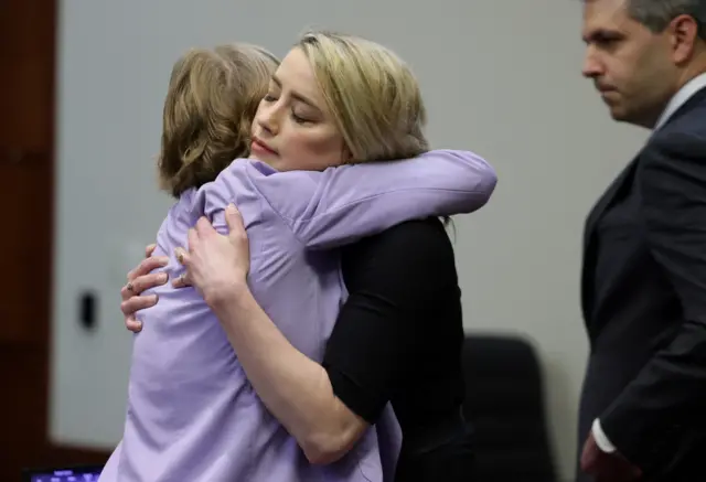 Amber Heard hugs her lawyer Elaine Bredehoft