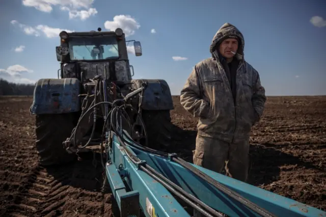 Local farm worker Vladimir takes a break from ploughing a field near the village of Yakovlivka near Kharkiv in April