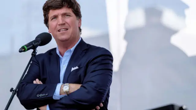 Tucker Carlson seen speaking at an event in Hungary last year