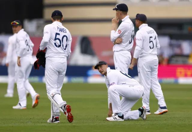 England's Joe Root reacts after dropping a catch