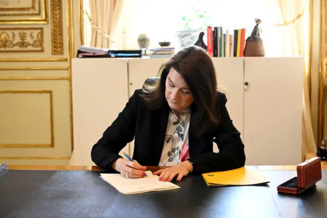 Ann Linde signs Sweden's application for Nato membership last month