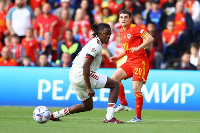 Dan James plays a ball past Dedryck Boyata