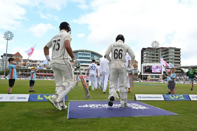 New Zealand's Daryl Mitchell and Tom Blundell walk out for day two