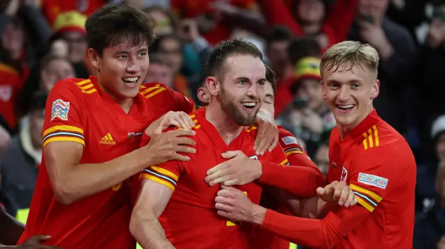 Wales players congratulate Rhys Norrington-Davies