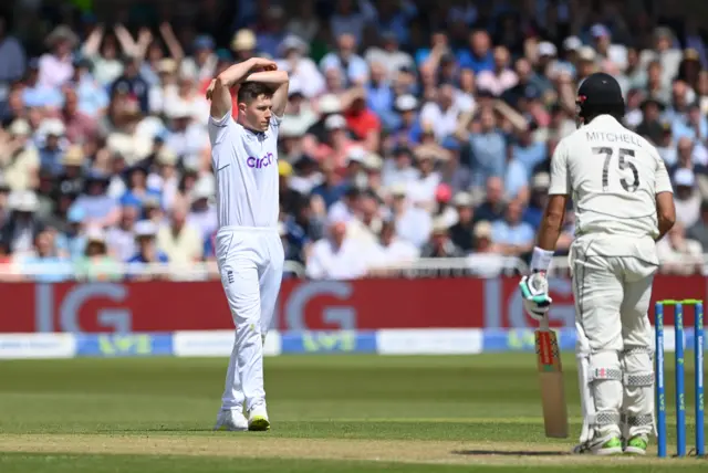 England bowler Matthew Potts reacts after a ball goes past the edge of the bat of New Zealand batsman Daryl Mitchell during day two of the Second Test Match at Trent Bridge