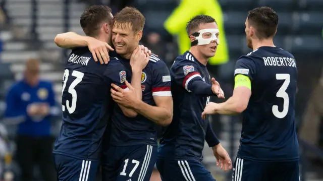 Scotland's Anthony Ralston celebrates with teammates after making it 1-0 during a UEFA Nations League match between Scotland and Armenia at Hampden Park