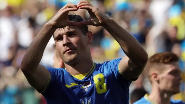 Ukraine's Ruslan Malinovskyi celebrates scoring their first goal