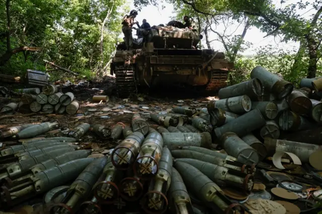 Shells are seen around a tank