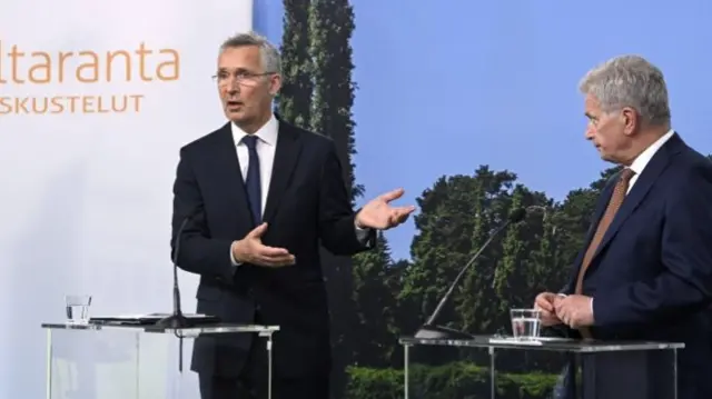 Nato Secretary General Jens Stoltenberg speaks as Finnish President Sauli Niinisto listens at a press conference