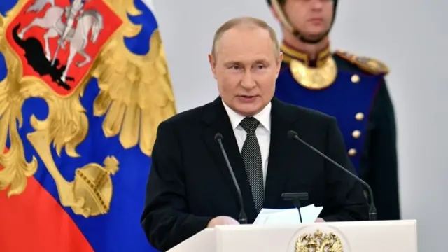 Russia's President Vladimir Putin attends a ceremony to present state awards to honourees for outstanding achievements on Russia Day in Moscow