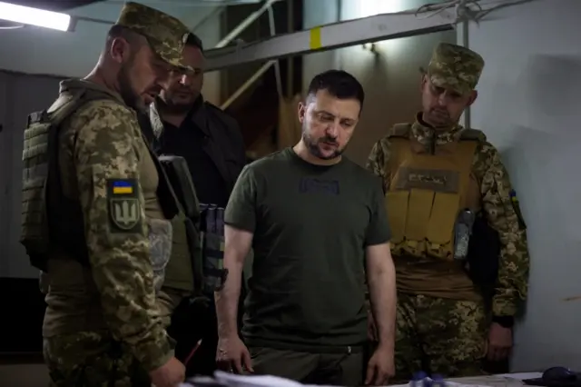 President Zelensky, with Ukrainian soldiers, during a visit to armed forces positions in Soledar, Donetsk on 5 June