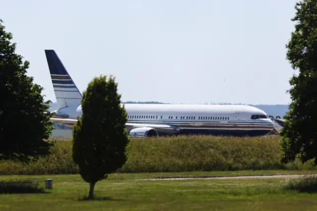 A plane reported by British media to be first to transport migrants to Rwanda is seen on the tarmac at MOD Boscombe Down base in Wiltshire, Britain, June 14, 2022