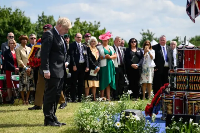 Boris Johnson laid a wreath during a service at the National Memorial Arboretum on Tuesday