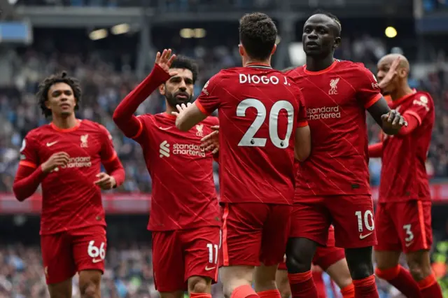 Liverpool celebrate a goal against Man City