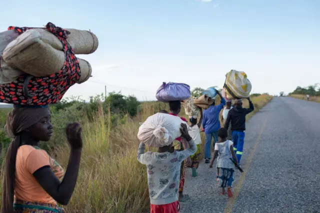 Displaced families from the community of Impire, a town in the district of Metuge in the Cabo Delgado province, flee on June 14, 2022