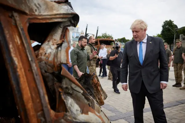 Boris Johnson with mangled equipment