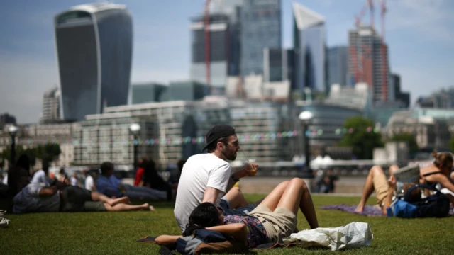 People sunbathing in a London park