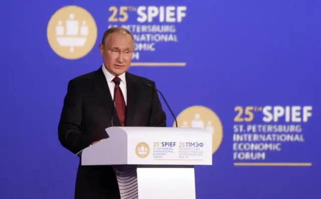 Russian President Vladimir Putin delivers a speech during a session of the St. Petersburg International Economic Forum