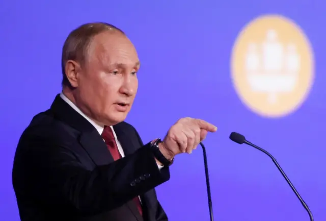 Russian President Vladimir Putin delivers a speech during a session of the St. Petersburg International Economic Forum