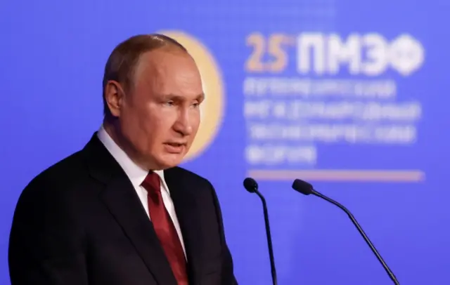 Russian President Vladimir Putin delivers a speech during a session of the St. Petersburg International Economic Forum