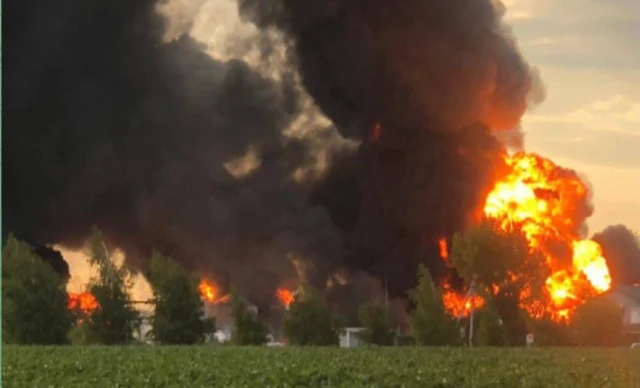 Thick black smoke rises from a fire at an oil depot in Dnipropetrovsk