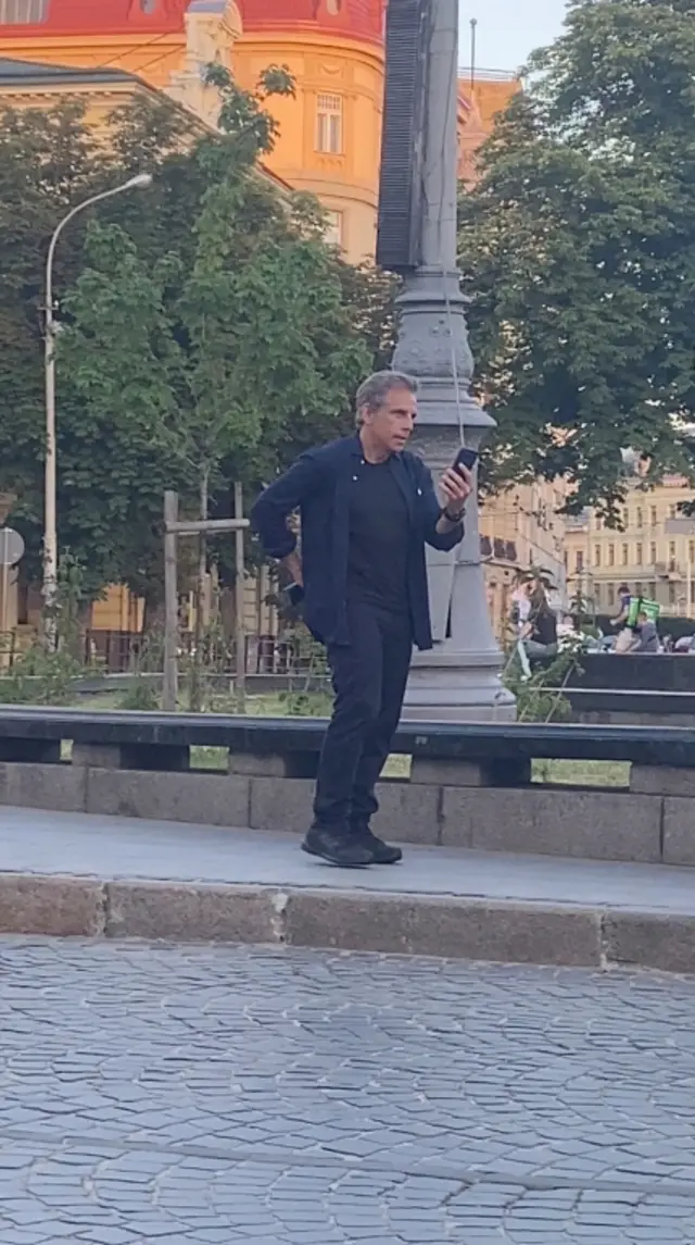 Actor Ben Stiller speaks on a phone while walking in Lviv, Ukraine, on 18 June 2022, in this screengrab obtained from a social media video