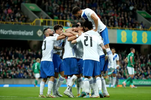 Greece celebrate their winning goal