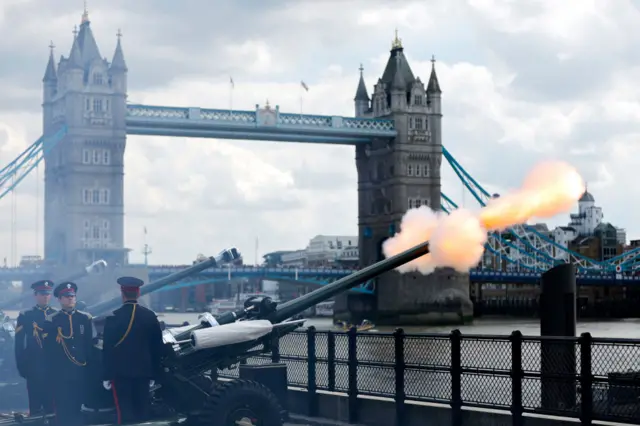 The Honourable Artillery Company fire a Royal gun salute at Tower Bridge