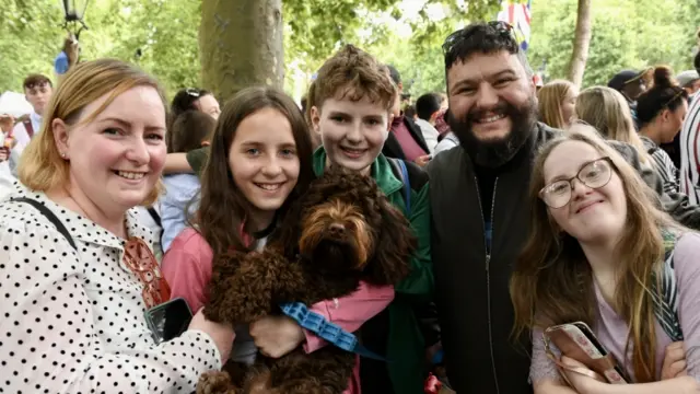 A family of five enjoy the festivities on The Mall