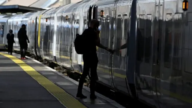 Passengers boarding train