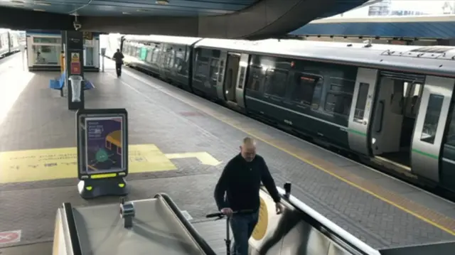 Passenger on a deserted train station in the south of England