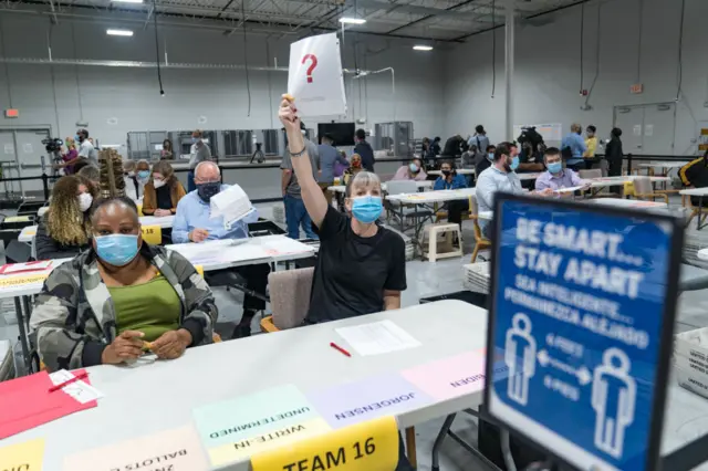 Recount workers in Georgia count ballots in 2021