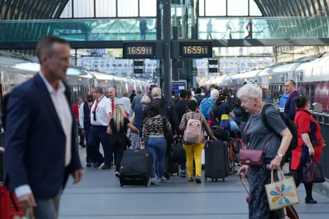 Passengers at London King's Cross station