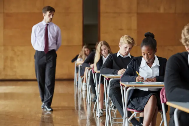 Stock image of students in an exam hall