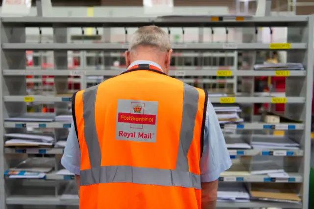 Royal Mail staff at work in a sorting office in Cardiff