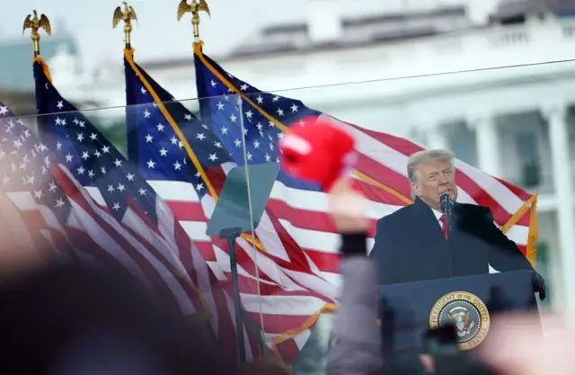 Trump speaking at the White House as the violence began to unfold blocks away