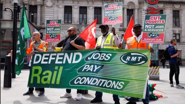 RMT members on picket line outside Victoria station in London