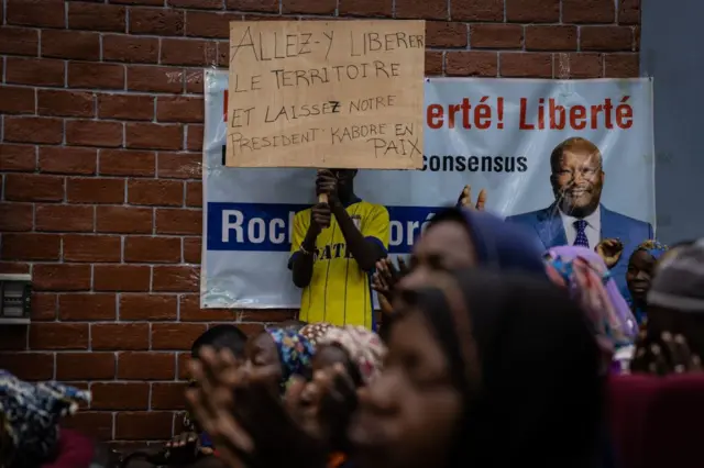 Supporters of Burkina Faso ousted president Roch Marc Christian Kaboré gather in Ouagadougou, on May 28, 2022 during an indoor rally demanding his release.