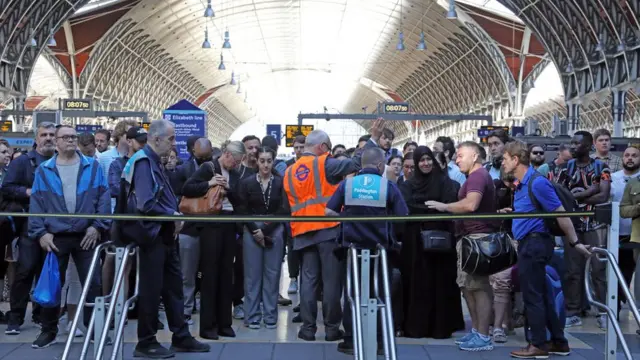 Commuters await reopening of the London Underground