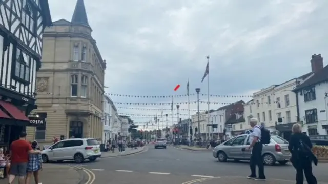 People and cars on a street in Stratford-upon-Avon