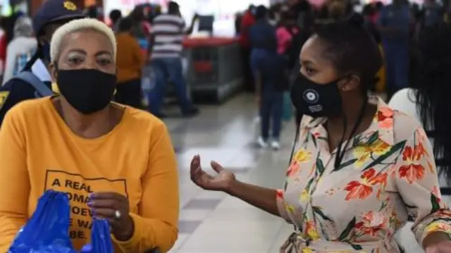 South African wearing face masks in a shopping centre in Cape Town