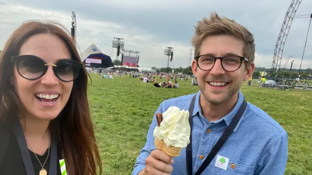 Victoria and Steffan holding an ice-cream at Glastonbury