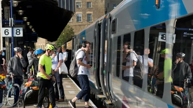 Commuters boarding a TPE train